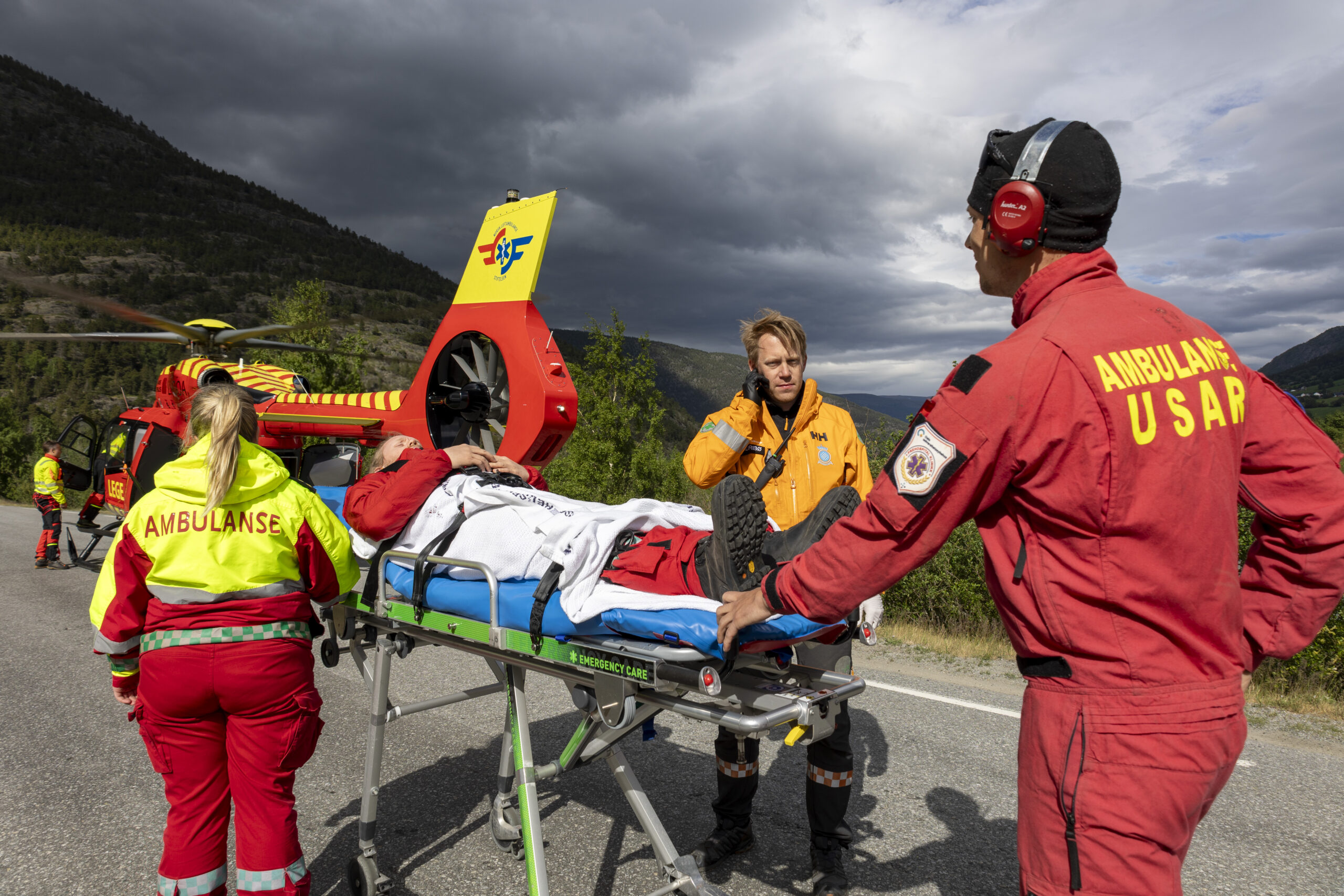 The air ambulance, the ambulance and voluntary sector training together, transporting a patient to the helicopter. 