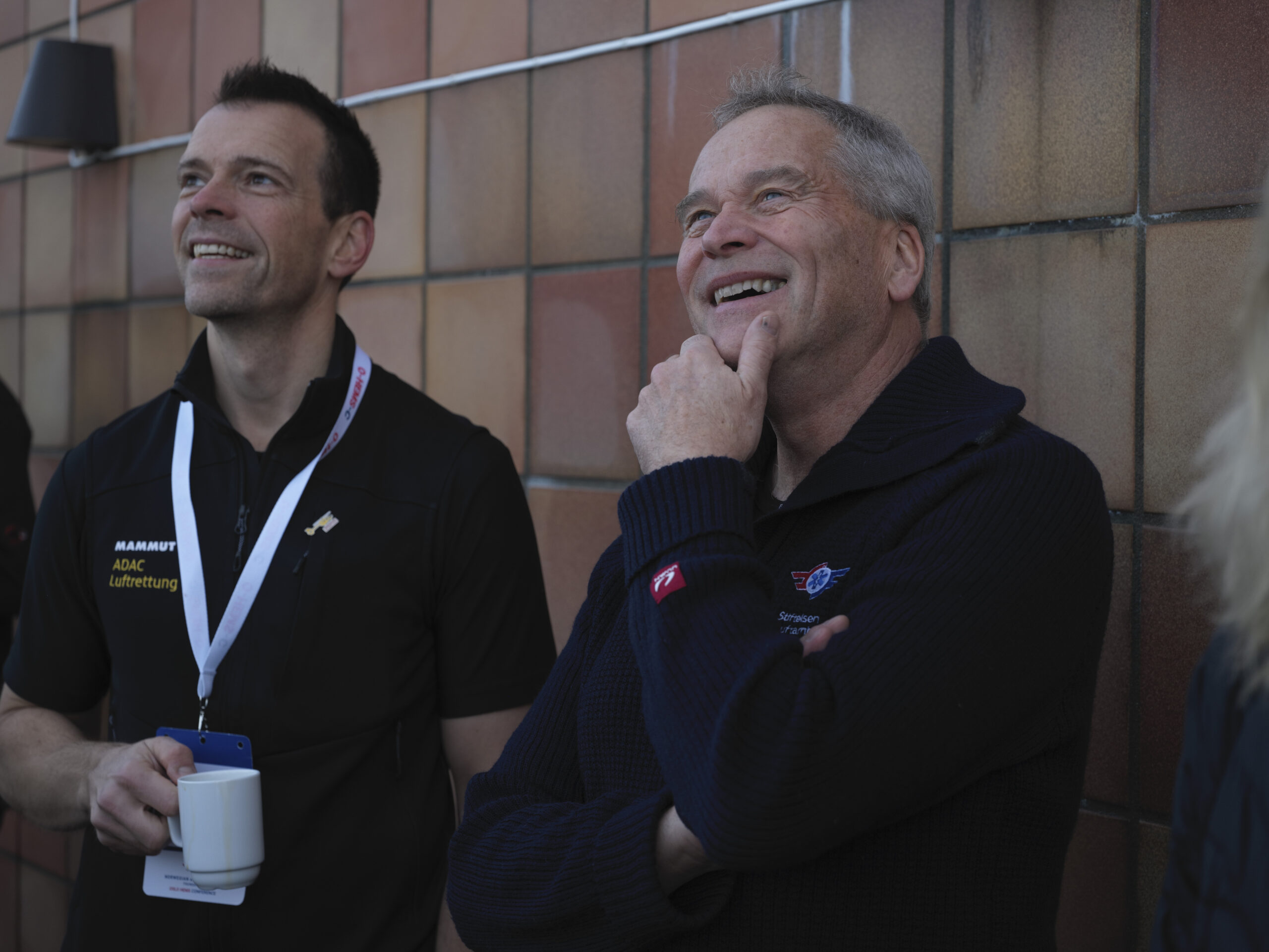 ADAC's Arne Fleischhacker and Conference Chair Hans Morten Lossius enjoying the hoisting demonstration by the R&D Helicopter.