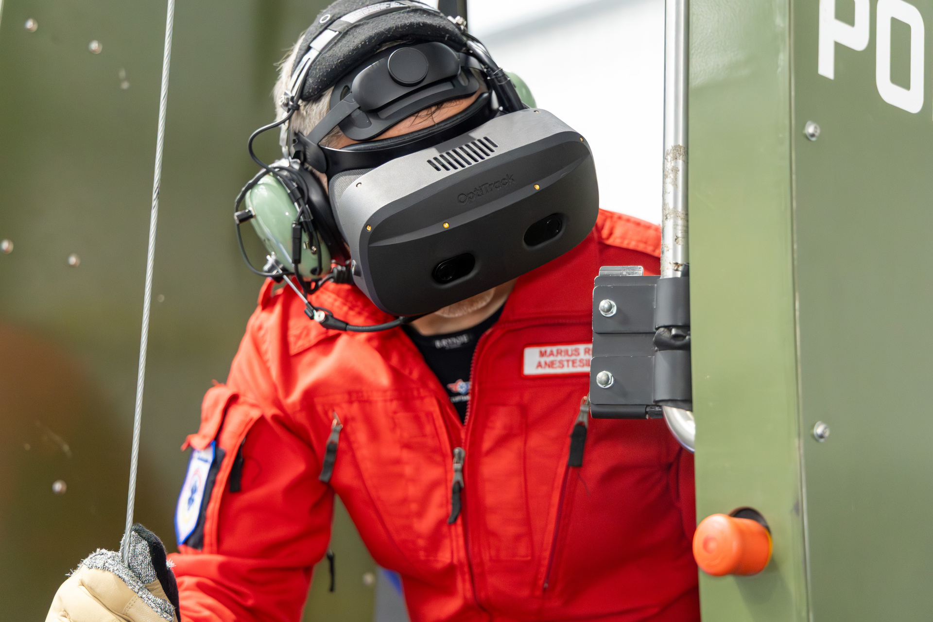 HEMS Physician Marius Rehn wearing VR goggles during the simulator training for hoist operators.