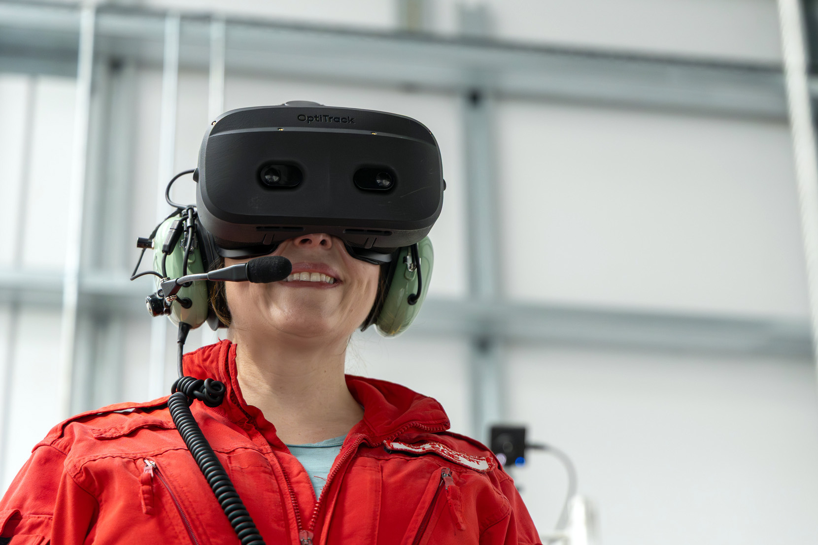 HEMS Physician Toril Strickert wearing VR goggles during the simulator training for hoist operators.